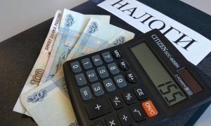 Глава банка ВТБ предложил освободить от уплаты налогов россиян с низкими доходами